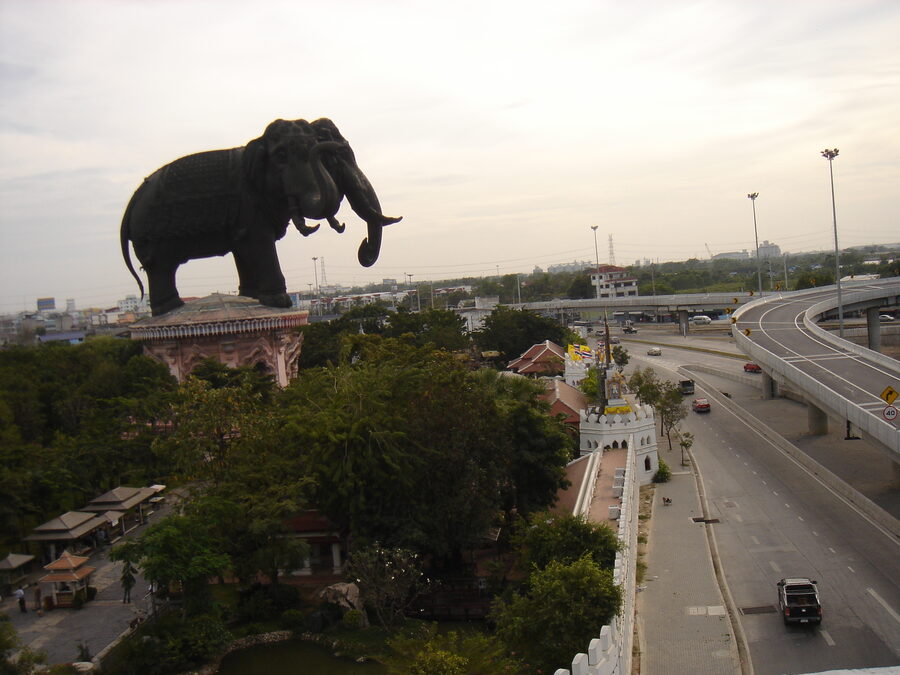 The three-headed elephant of the Erawan Museum against the evening sky